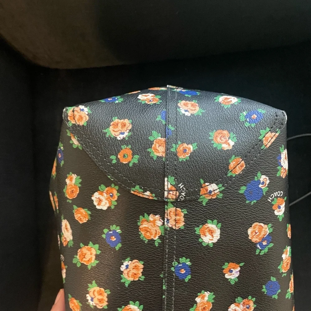Coach reversible city tote in great overall condition has some wear at handles.